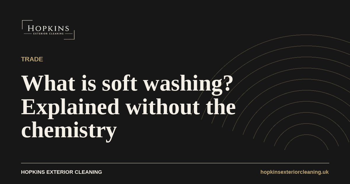 What is soft washing: a soft wash spray being applied at low pressure to a render wall