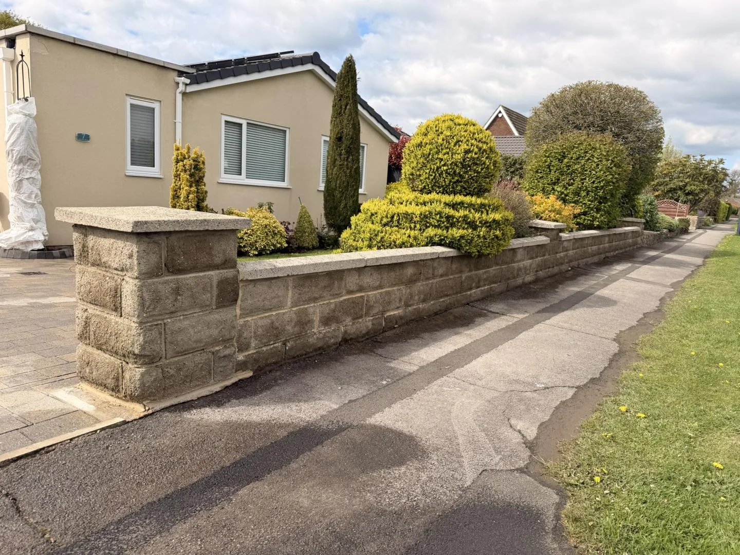 Stone boundary wall clean after cleaning by Hopkins Exterior Cleaning