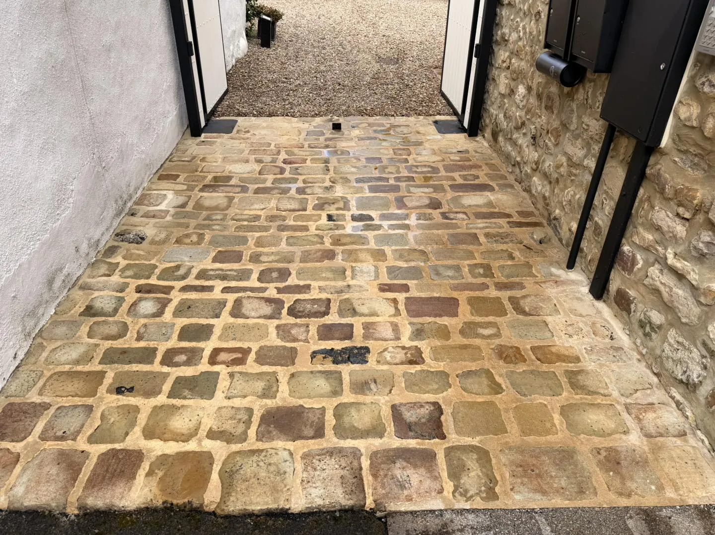 Cobble entrance clean before cleaning by Hopkins Exterior Cleaning