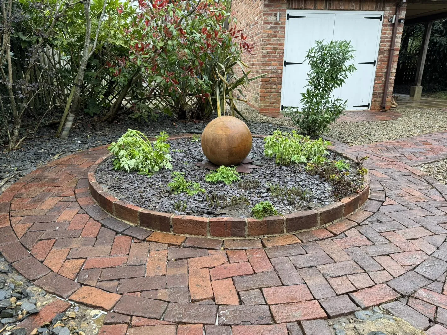 Circular garden patio clean after cleaning by Hopkins Exterior Cleaning