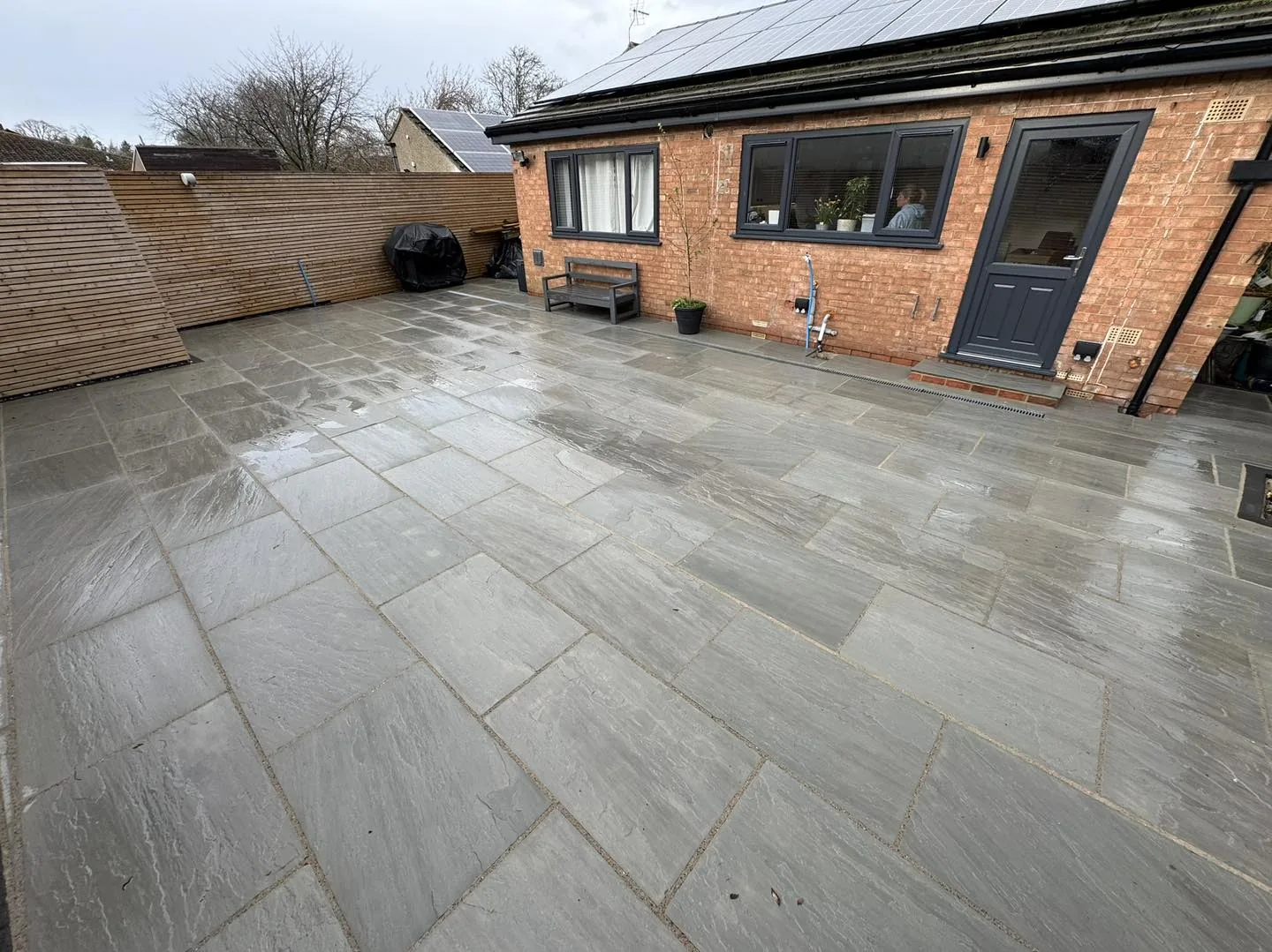 Green patio slab clean after cleaning by Hopkins Exterior Cleaning
