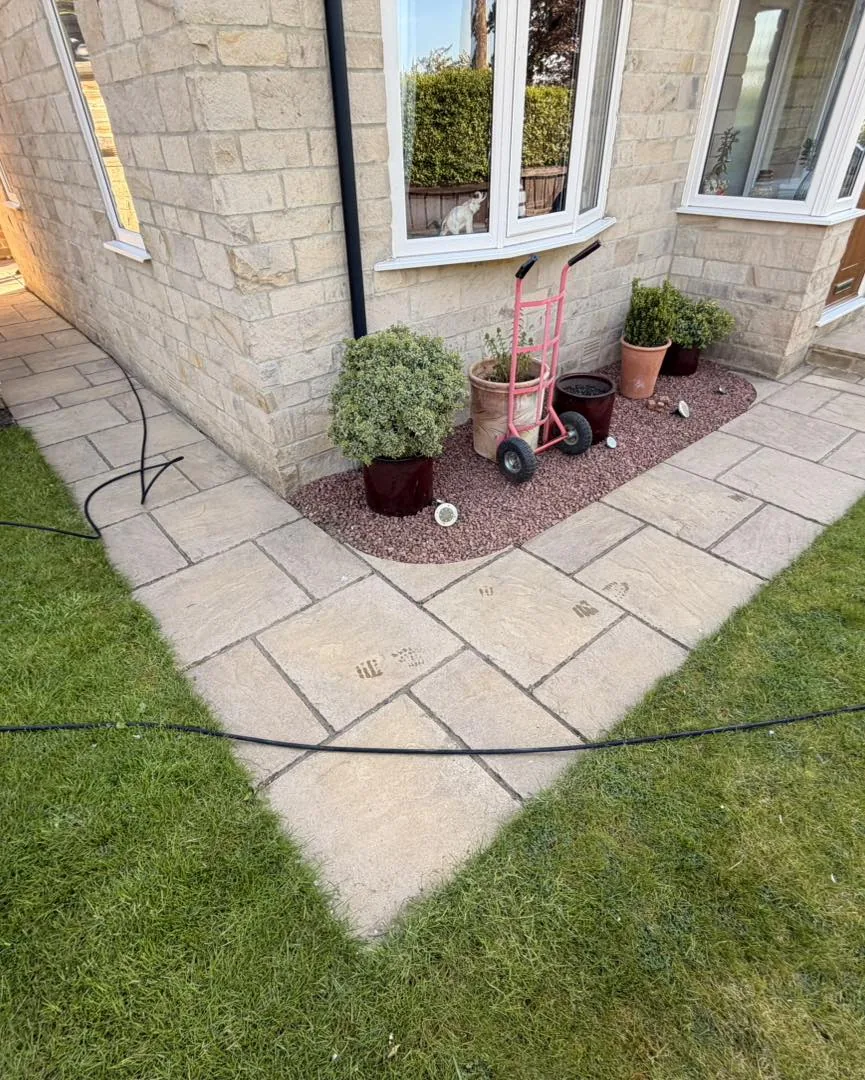 Small garden patio clean before cleaning by Hopkins Exterior Cleaning