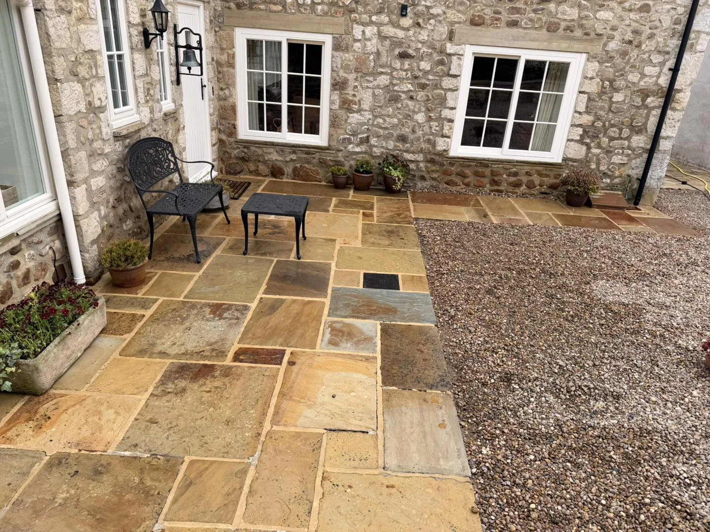 Stone slab patio colour reset after cleaning by Hopkins Exterior Cleaning