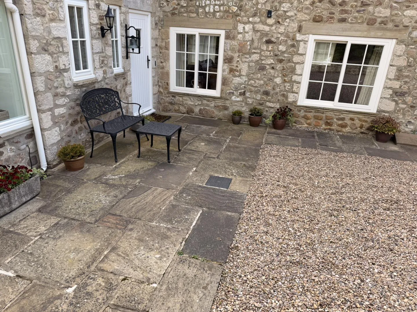 Stone slab patio colour reset before cleaning by Hopkins Exterior Cleaning